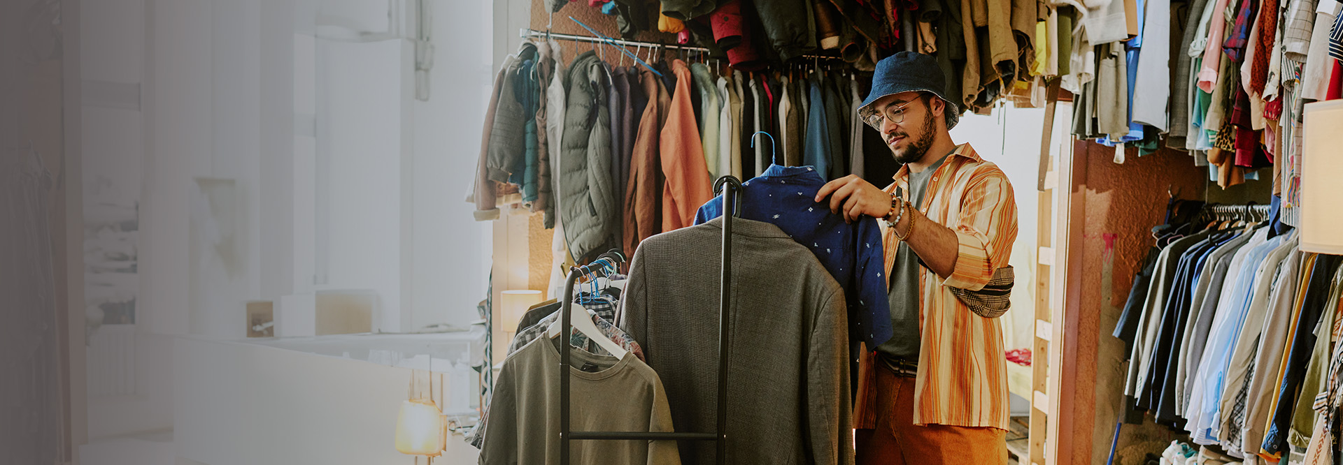 young man at a clothing store shopping